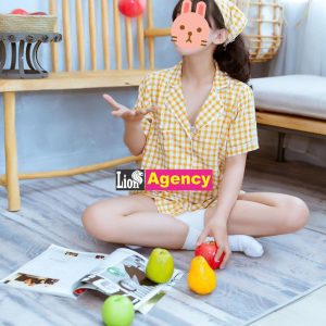 A girl is sitting on the floor playing with 707.