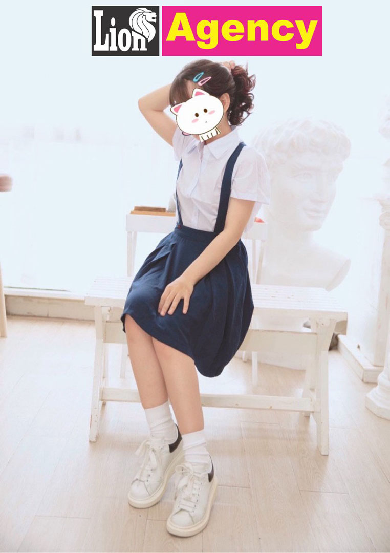 A 707 escort girl, portrayed as a girl in a school uniform, is seen peacefully sitting on a bench.