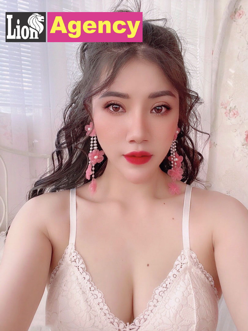 A 939 escort girl in lingerie posing for a picture.