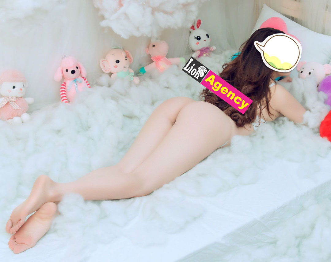 A woman laying on a bed surrounded by stuffed animals in Kuala Lumpur, also known as KL, was seen using the 901.