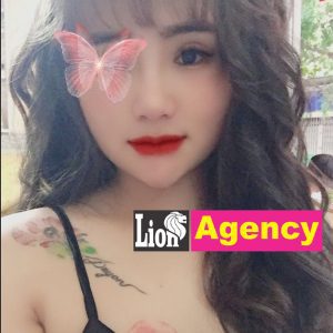 A girl with a butterfly tattoo on her face offering escort services in KL.