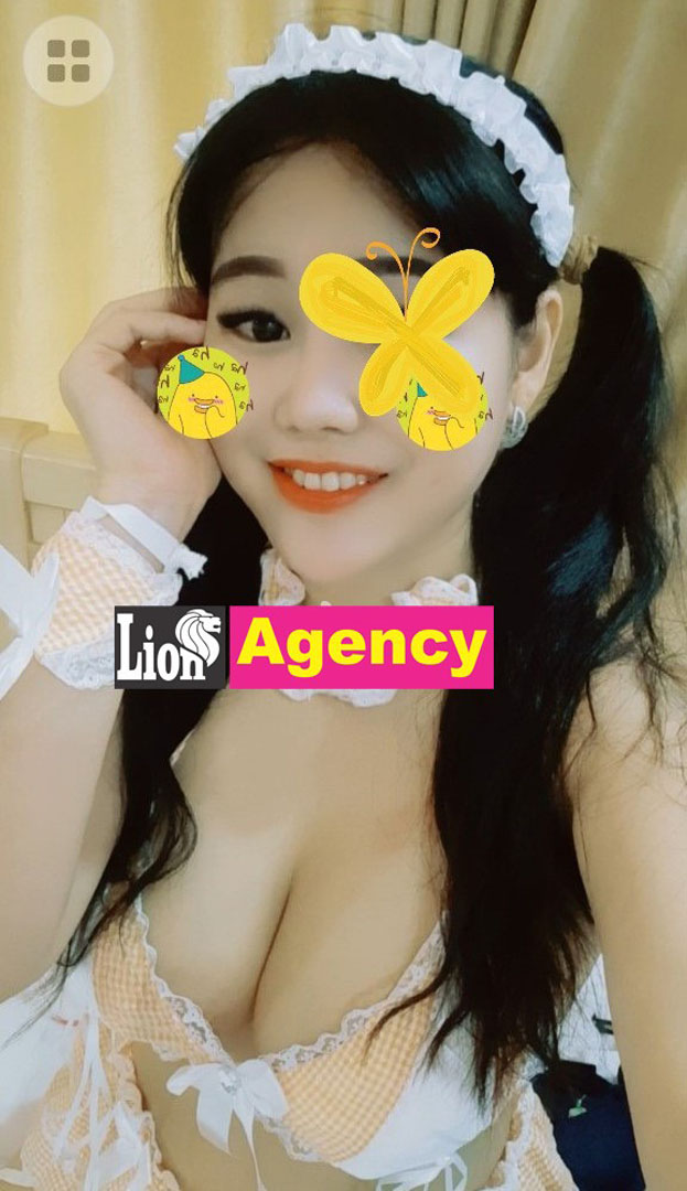 A young woman in a maid outfit posing for a picture, also working as an escort in Vietnam and Kuala Lumpur, the 407.